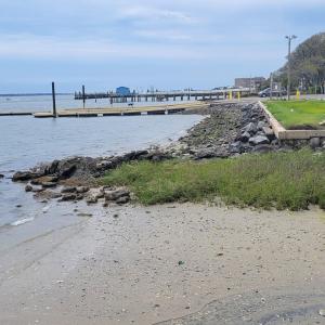 adjacent to the boat ramp